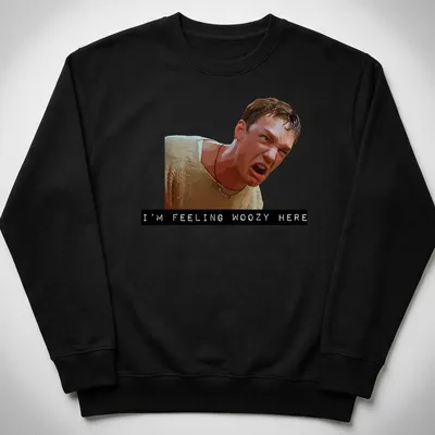 Digital illustration of an angry character with the text 'I'M FEELING WOOZY HERE' — printed on a unisex sweatshirt