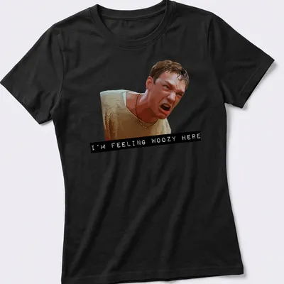 Digital illustration of an angry character with the text 'I'M FEELING WOOZY HERE' — printed on a women's shirt