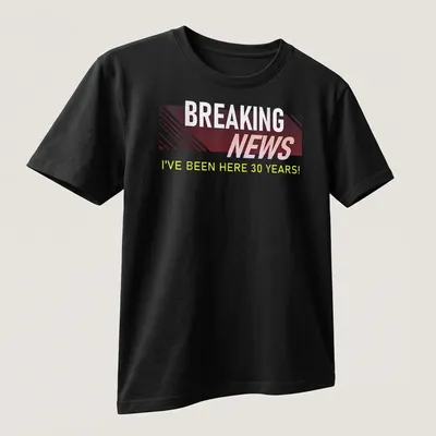 Bold Breaking News t-shirt celebrating 30 years at work with modern typography — printed on a unisex t-shirt (angled view)
