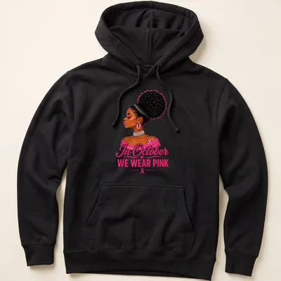 Vibrant illustration of an Afro woman with text 'In October WE WEAR PINK' — printed on a unisex hoodie