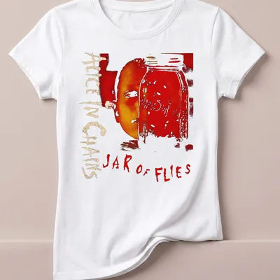 Artistic design of a jar with a face and 'Alice In Chains Jar of Flies' text in red and gold — printed on a women's shirt