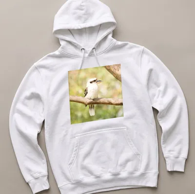Realistic photo of a laughing kookaburra bird on a branch — printed on a unisex hoodie