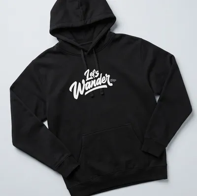Vintage camping scene with trees, tent, and text 'LET'S WANDER' in earthy colors — printed on a unisex hoodie