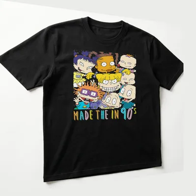 Colorful cartoon characters with text 'MADE THE IN 90s' on — printed on a unisex t-shirt (angled view)