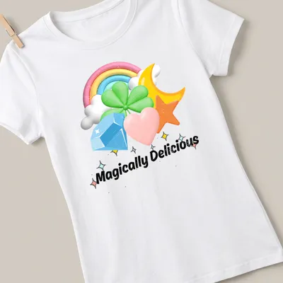 Colorful cartoon t-shirt with rainbow charms and the text Magically Delicious — printed on a women's shirt
