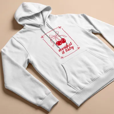 Kawaii line-art shirt with cherries and a bow, featuring "manifest it baby" text — printed on a unisex hoodie