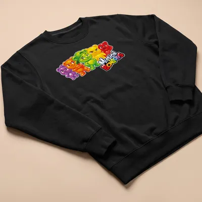Cartoonish T-shirt featuring colorful jujube bear characters with playful expressions. — printed on a unisex sweatshirt