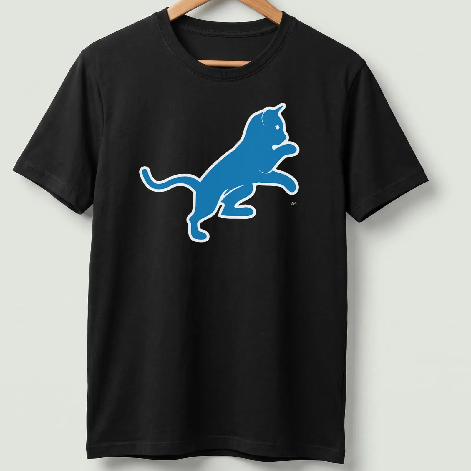 Silhouette of a blue cat with the text Motor City Kitties — printed on a unisex t-shirt
