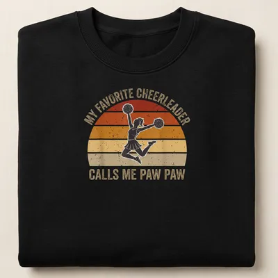 Retro style shirt with text about being a proud Paw Paw and a cheerleader graphic — printed on a unisex sweatshirt