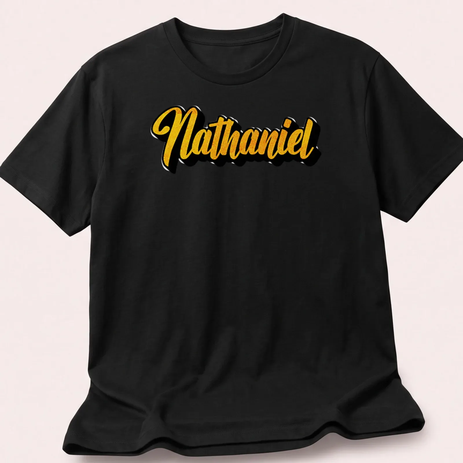 Personalized Nathaniel t-shirt with bold gold script on black. — printed on a unisex t-shirt