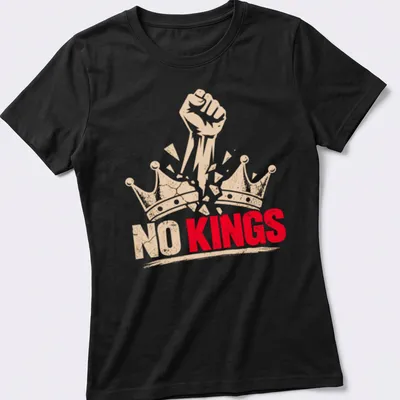 Bold graphic of a fist breaking through crowns with text 'NO KINGS' — printed on a women's shirt