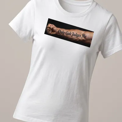 Bold script t-shirt with tattoo design reading 'Only God Judges Me' on an arm — printed on a women's shirt