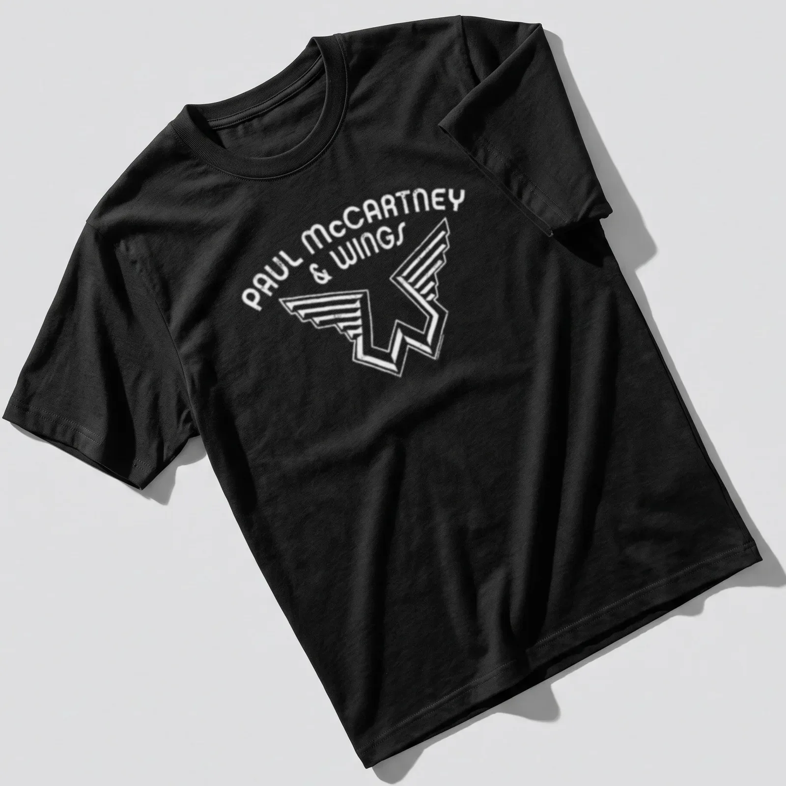 Black and white Paul McCartney and Wings logo — printed on a unisex t-shirt