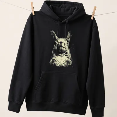 Line-art of a peaceful squirrel with earbuds in cream and light yellow — printed on a unisex hoodie
