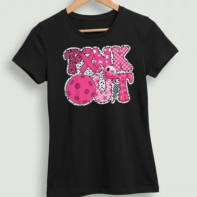 Colorful graphic t-shirt with Pickleball and pink ribbon design — printed on a women's shirt