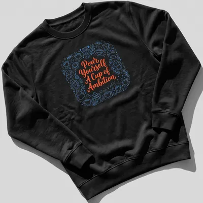 Whimsical coffee and croissants design with playful text in blue and orange — printed on a unisex sweatshirt