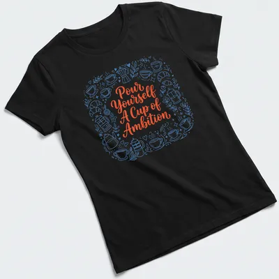 Whimsical coffee and croissants design with playful text in blue and orange — printed on a women's shirt