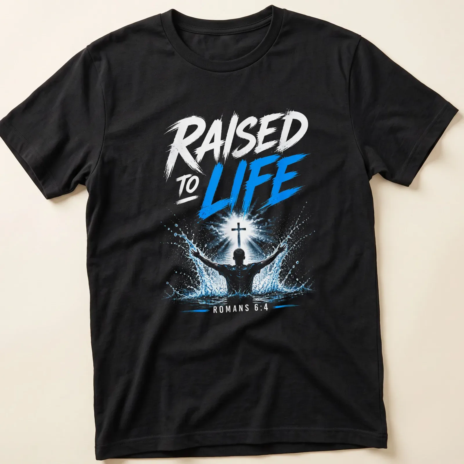 Illustrative baptism T-shirt with a person, cross, and splash effects in blue and white — printed on a unisex t-shirt