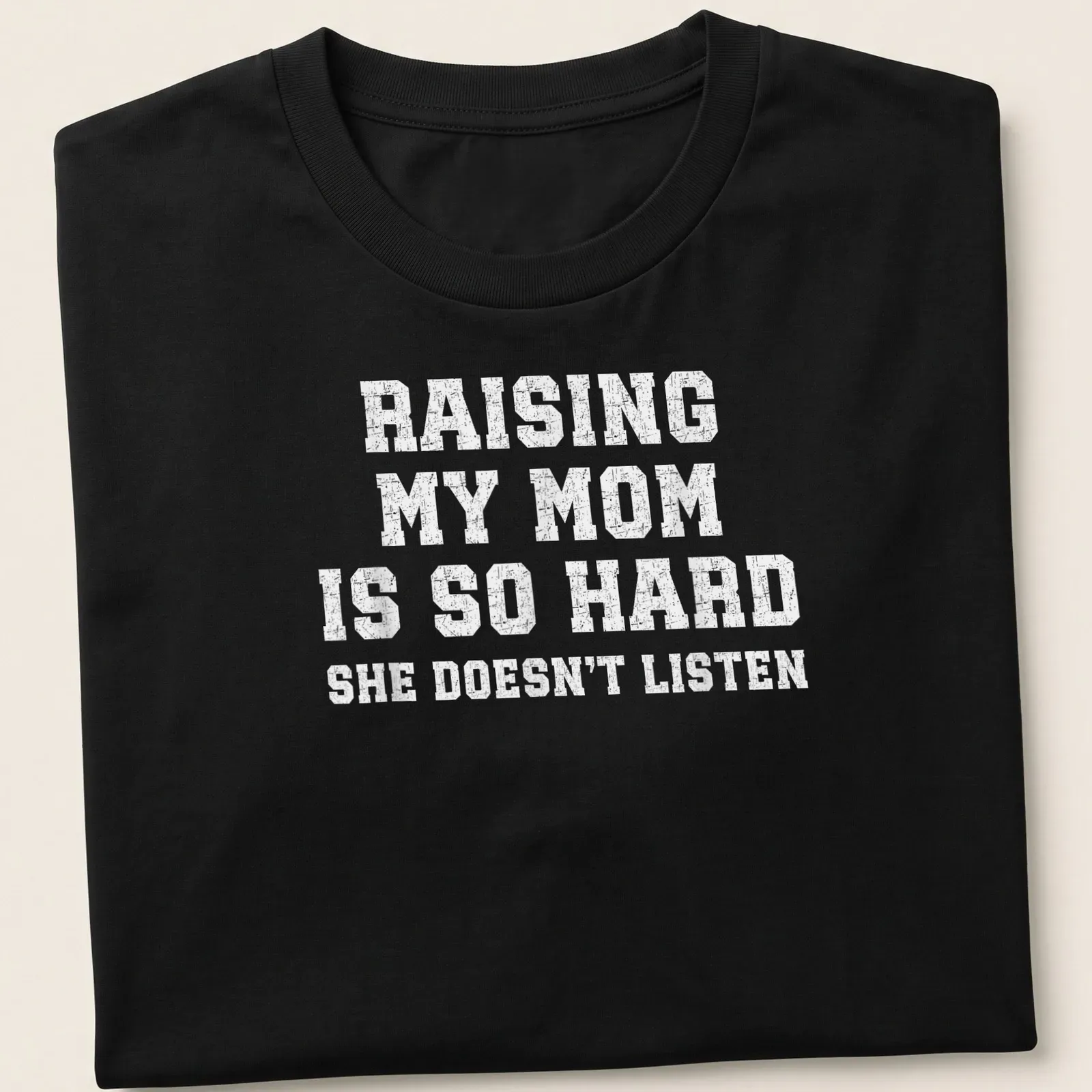 Bold distressed text t-shirt that humorously addresses parenting challenges. — printed on a unisex t-shirt