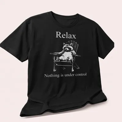 Vintage illustration of a funny raccoon with humorous text about control — printed on a unisex t-shirt (angled view)