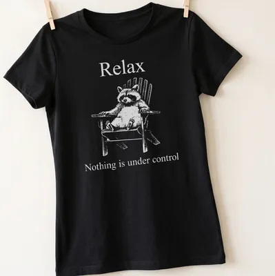 Vintage illustration of a funny raccoon with humorous text about control — printed on a women's shirt