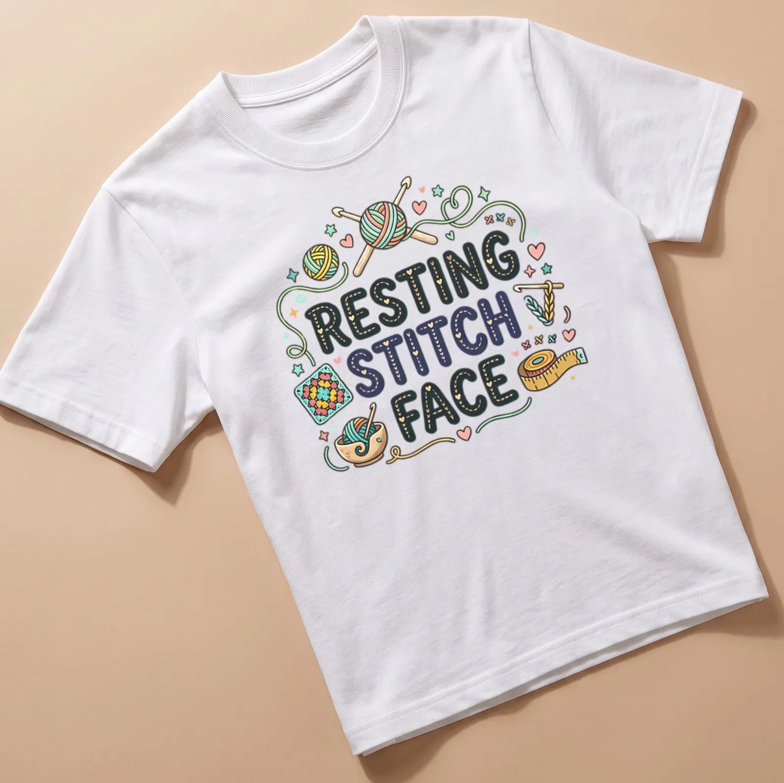 Colorful whimsical design featuring crochet yarn and knitting tools with text 'Resting Stitch Face' — printed on a unisex t-shirt