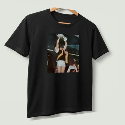 Photographic print of Royce Hart holding a trophy in team colors. — printed on a unisex t-shirt (angled view)