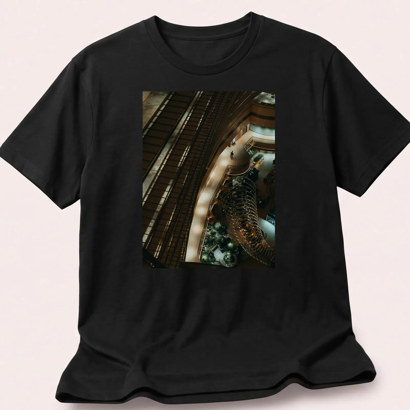 Illustration of a kingfisher perched in a river scene with modern architectural style — printed on a unisex t-shirt