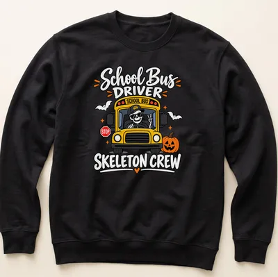 Cartoonish print of a cheerful skeleton school bus driver with vibrant colors — printed on a unisex sweatshirt