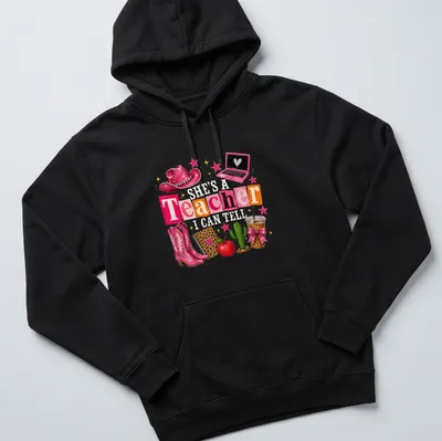 Colorful collage featuring cowgirl boots, cactus, and educational elements with a humorous saying for teachers — printed on a unisex hoodie