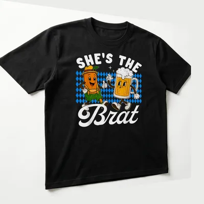 Kawaii cartoon design of a beer mug and sausage with text 'SHE'S THE BRAT' — printed on a unisex t-shirt (angled view)