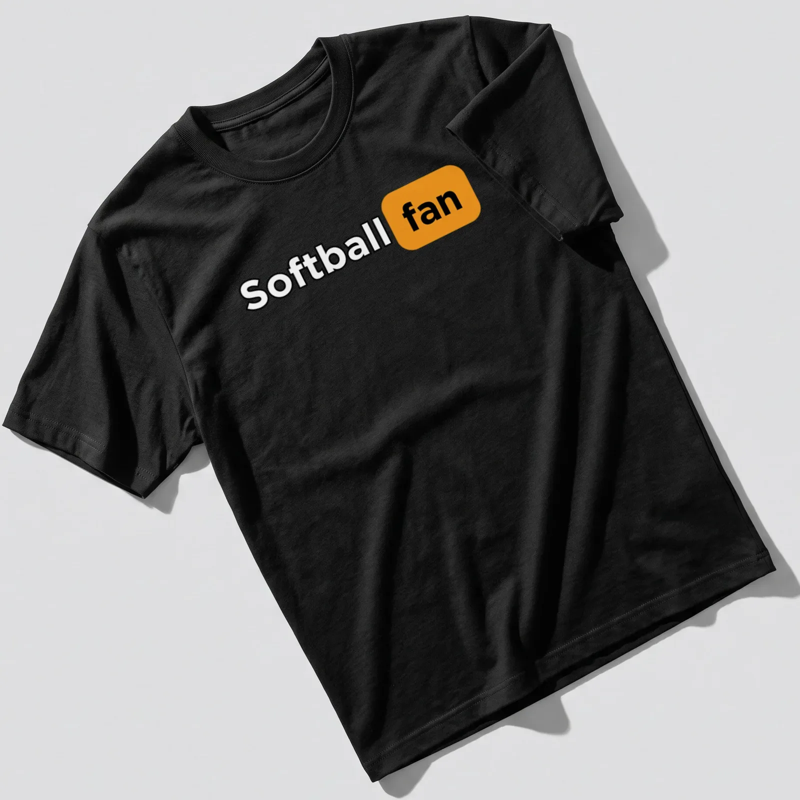 Bold graphic Softball Fan T-shirt in black, orange, and white colors. — printed on a unisex t-shirt