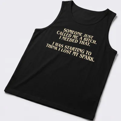 Bold typography t-shirt with a humorous empowering message in cream and light beige — printed on a tank top