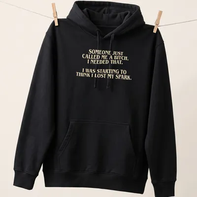 Bold typography t-shirt with a humorous empowering message in cream and light beige — printed on a unisex hoodie
