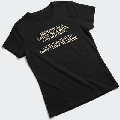 Bold typography t-shirt with a humorous empowering message in cream and light beige — printed on a women's shirt