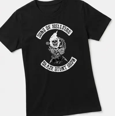 Flaming skull graphic with bold text for stunt show enthusiasts — printed on a women's shirt