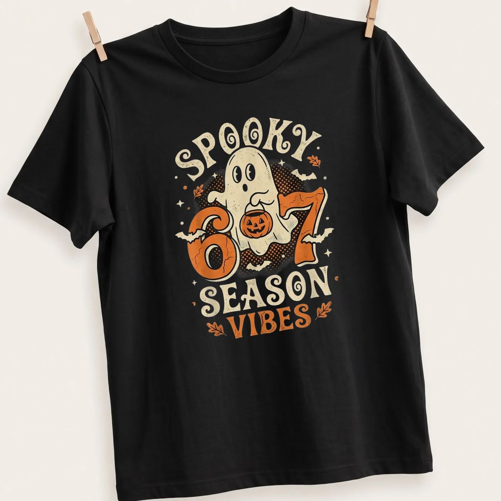 Vintage cartoon ghost with pumpkin and text reading Spooky 6 7 Season Vibes — printed on a unisex t-shirt