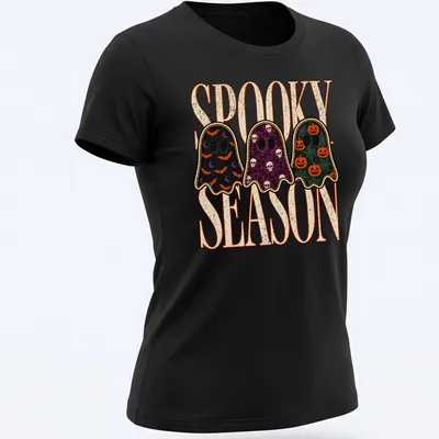 Vintage Halloween shirt with playful ghosts and spooky season text — printed on a women's shirt