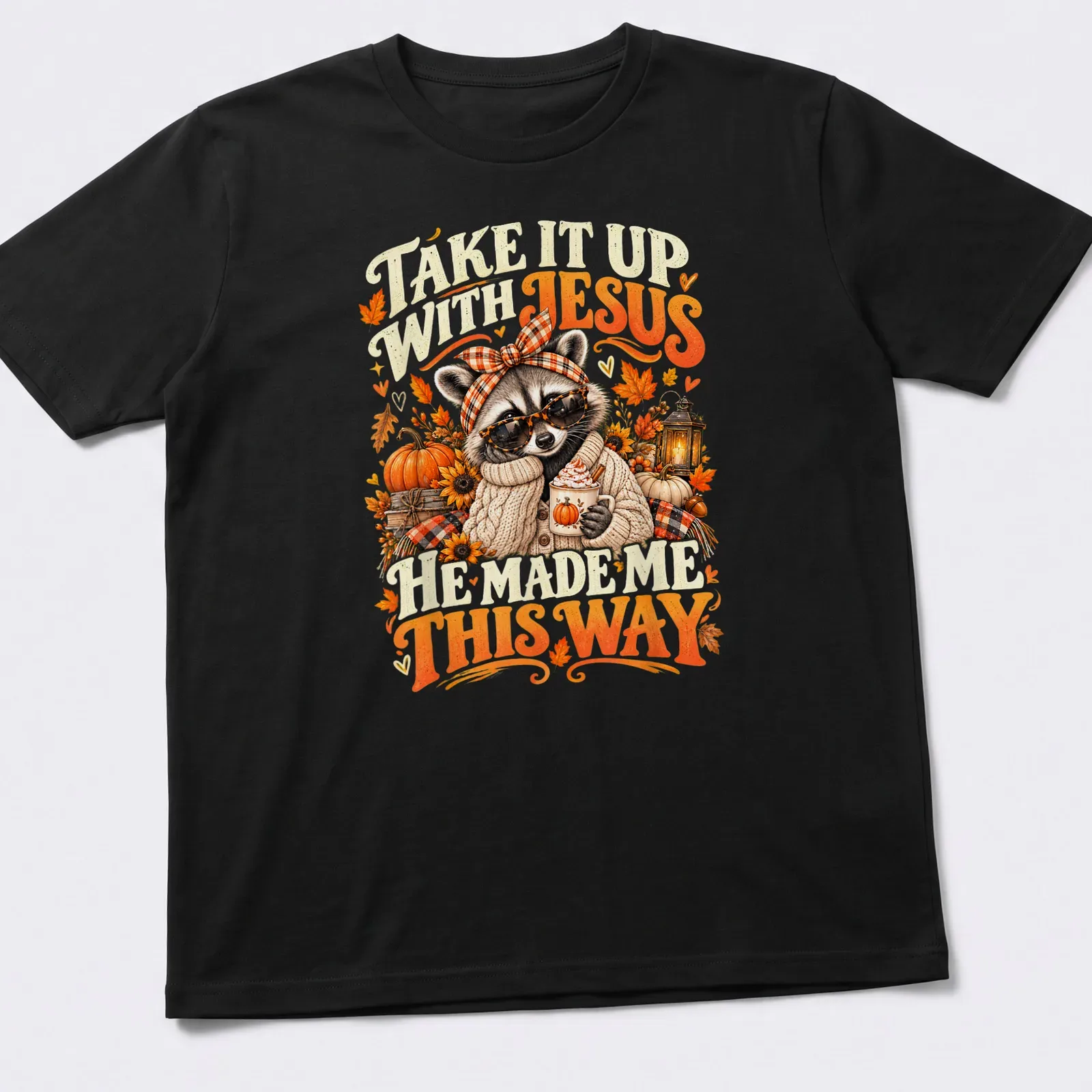 Vintage autumn-style T-shirt featuring a raccoon and playful text about Jesus. — printed on a unisex t-shirt