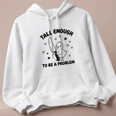 Cartoon duck holding a knife with humorous text above in black and white — printed on a unisex hoodie