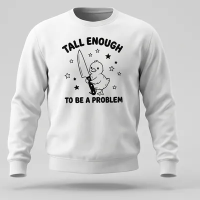 Cartoon duck holding a knife with humorous text above in black and white — printed on a unisex sweatshirt