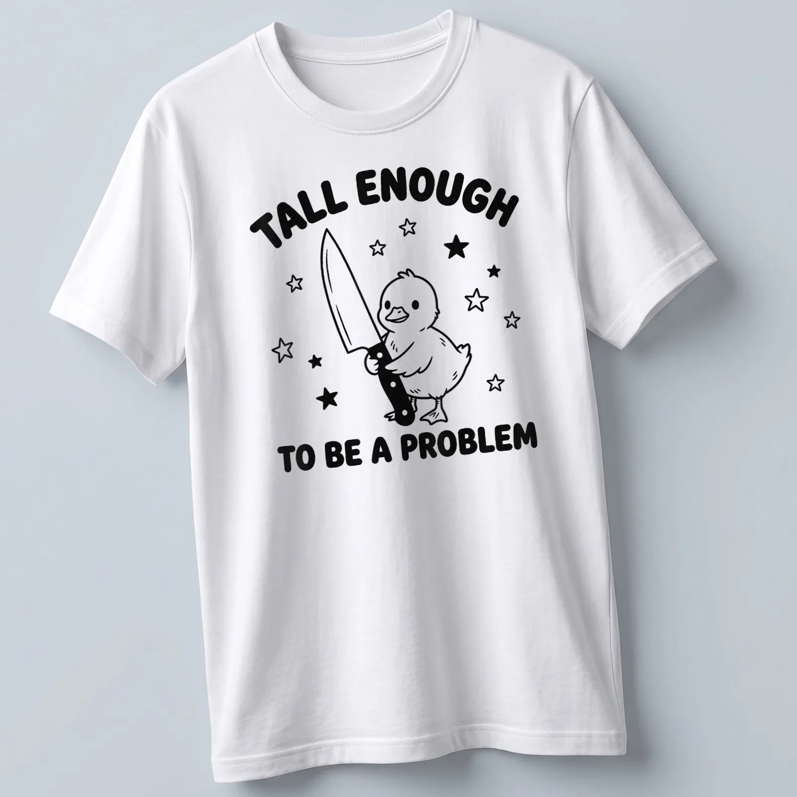 Cartoon duck holding a knife with humorous text above in black and white — printed on a unisex t-shirt