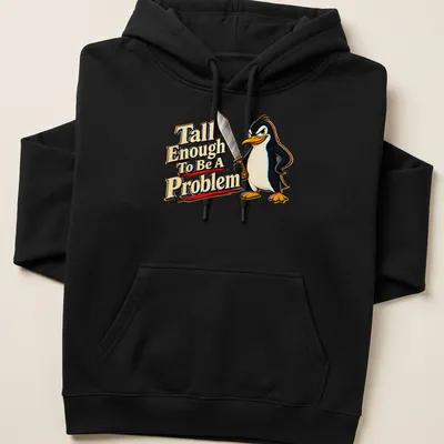 Cartoon penguin with humorous text about height in black, white, yellow, red, and blue. — printed on a unisex hoodie