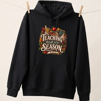 Vintage illustration of autumn-themed teacher supplies with the text Teaching through every SEASON — printed on a unisex hoodie