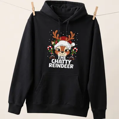 Cute kawaii reindeer graphic with colorful holiday elements — printed on a unisex hoodie