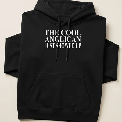 Bold typography T-shirt featuring Anglican Christian text in white — printed on a unisex hoodie