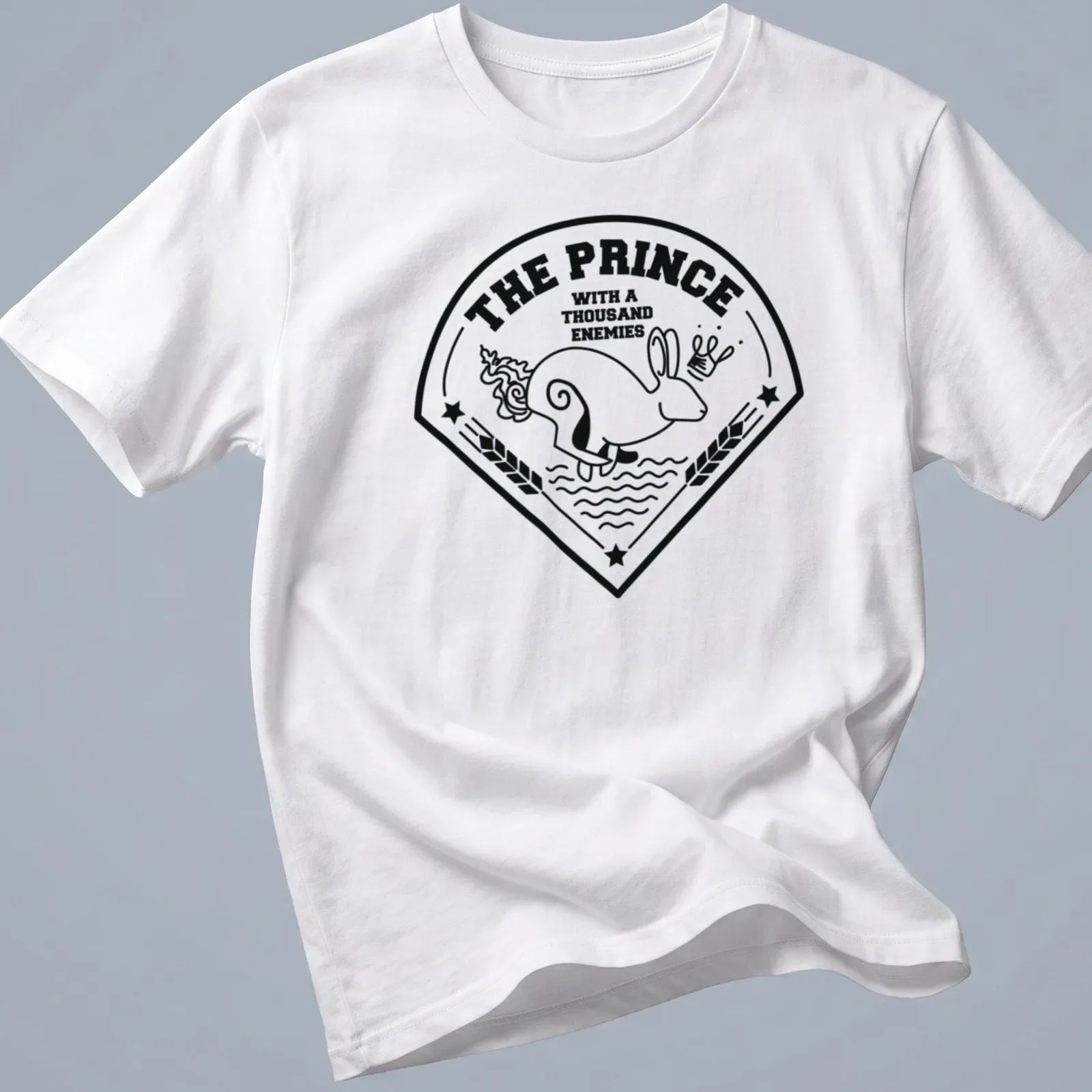 Bold line-art print of a rabbit with the text 'THE PRINCE WITH A THOUSAND ENEMIES' — printed on a unisex t-shirt