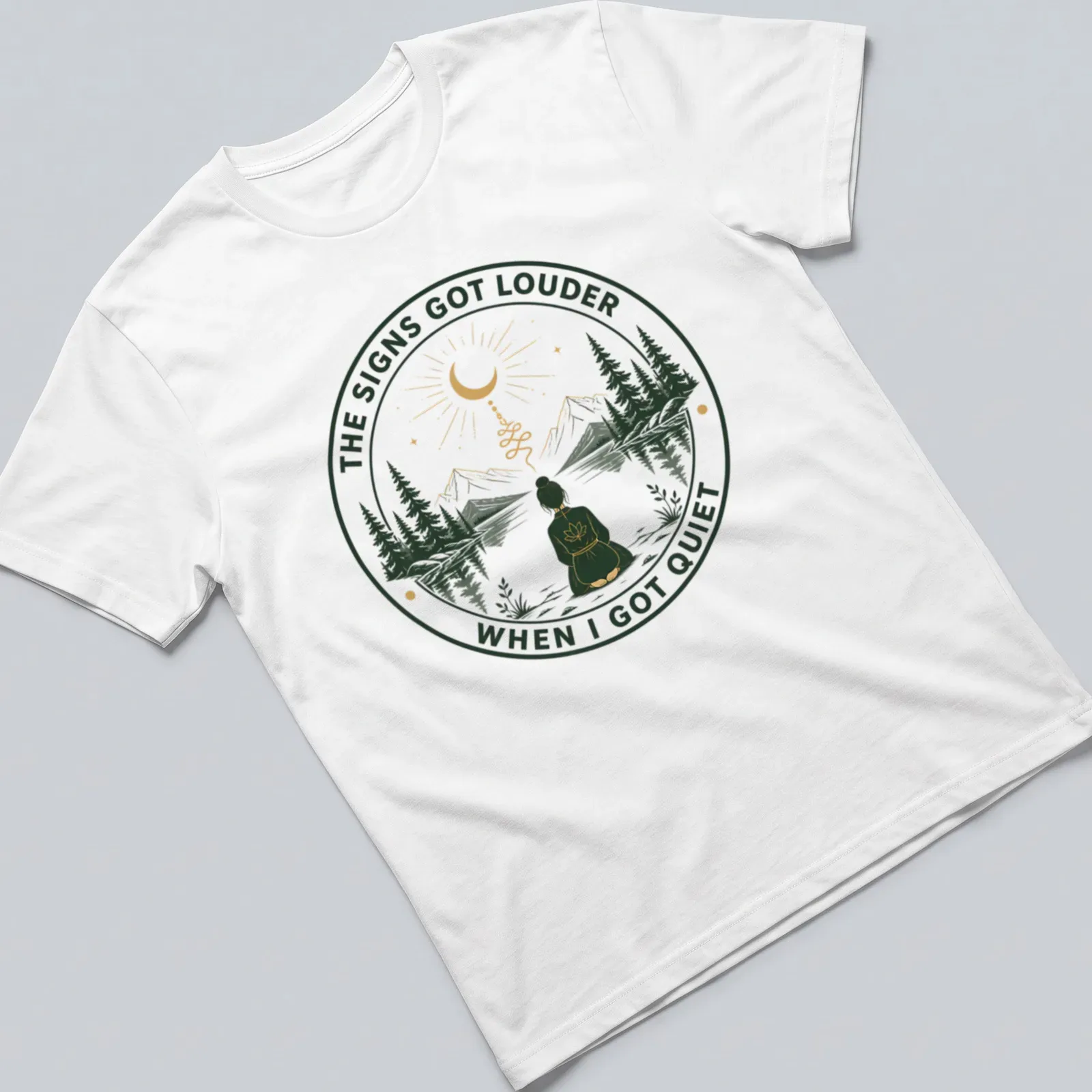 Meditation scene T-shirt with serene person and uplifting text in green and gold — printed on a unisex t-shirt
