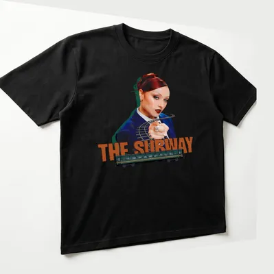 Vibrant digital art of a woman pointing beside a subway train with text 'THE SUBWAY' — printed on a unisex t-shirt (angled view)
