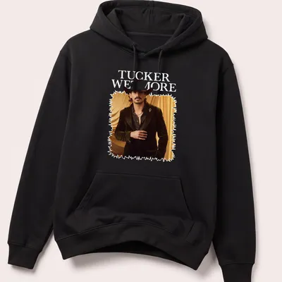 Fashion portrait T-shirt featuring a man in a cowboy hat and the name Tucker Wetmore — printed on a unisex hoodie